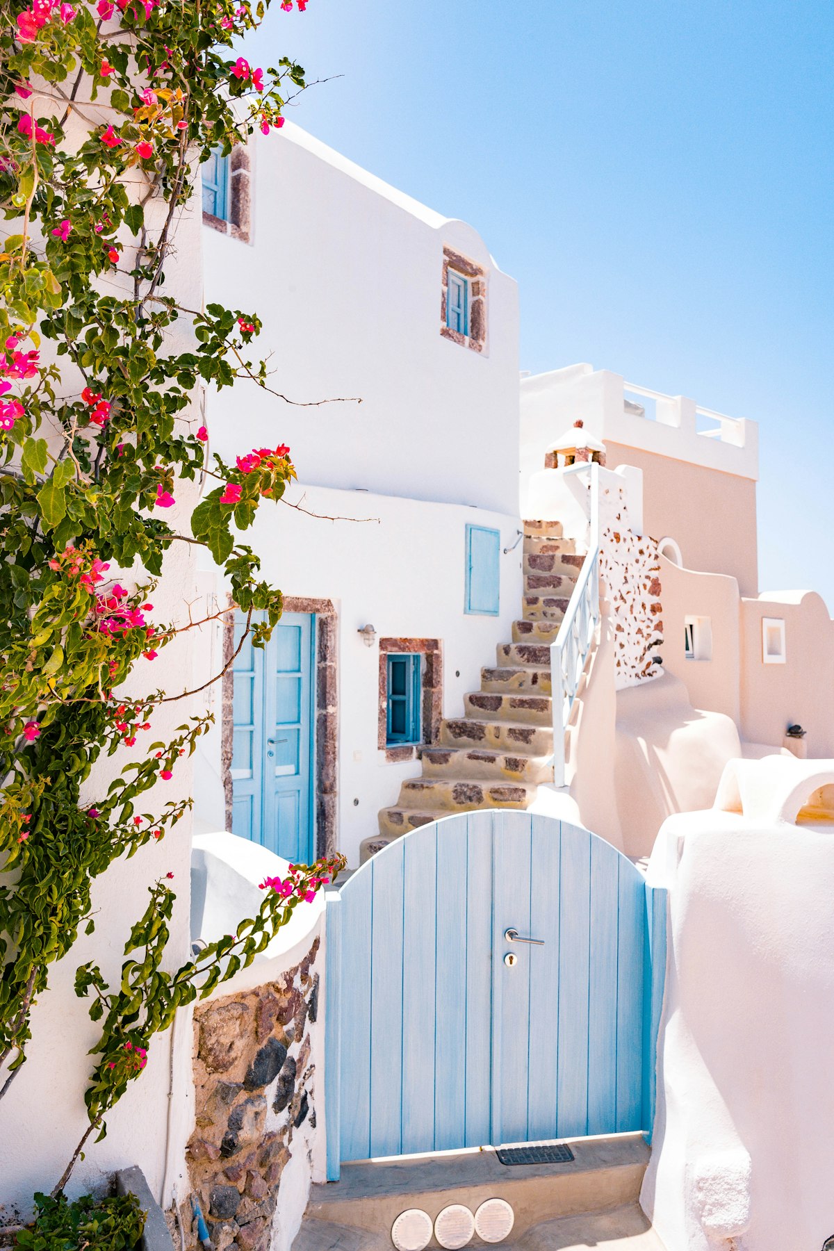 Santorini white architecture blue doors Oia Greece honeymoon travel costs