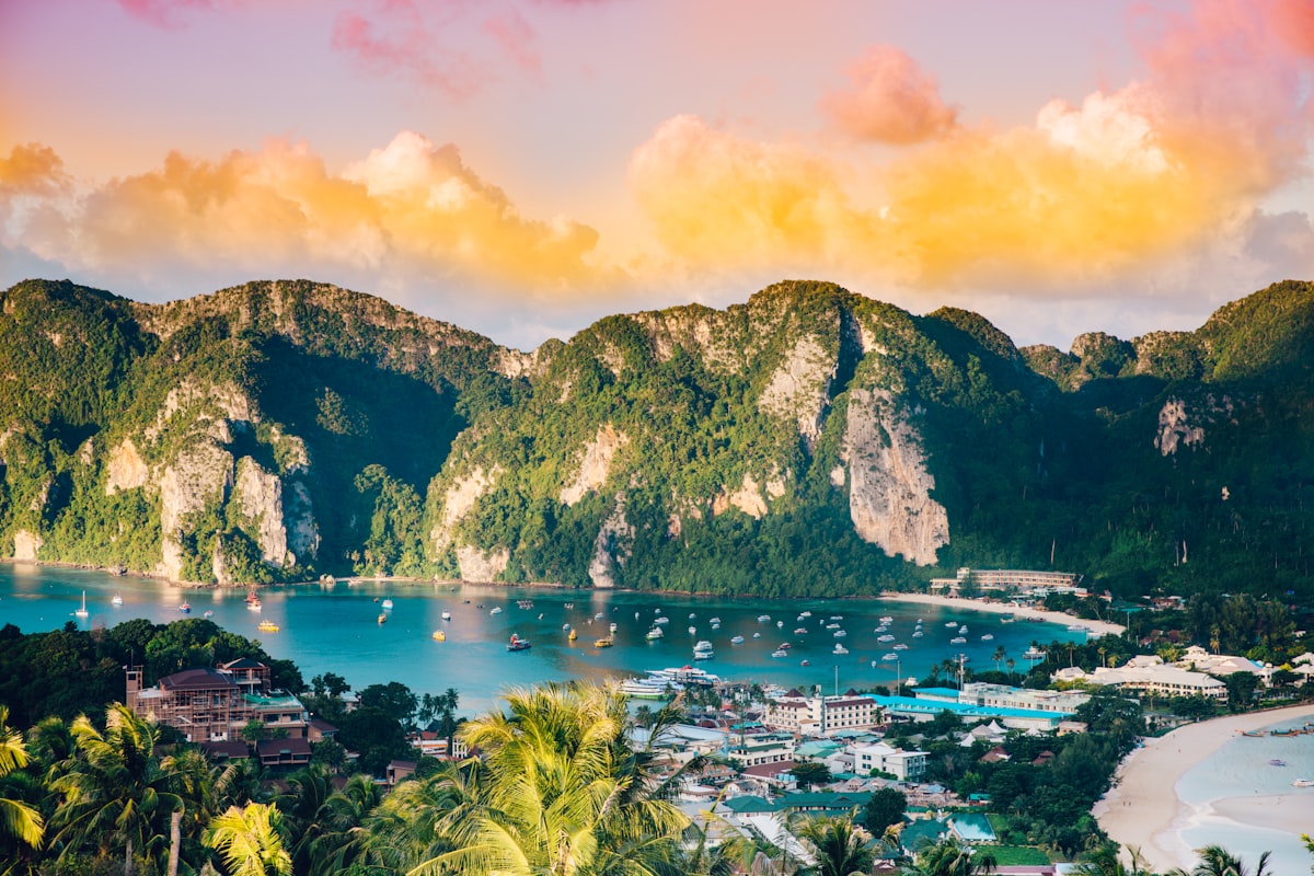 Thailand trip costs 2026 — aerial view of Koh Phi Phi islands with turquoise waters | tripbudgetcalculator.com