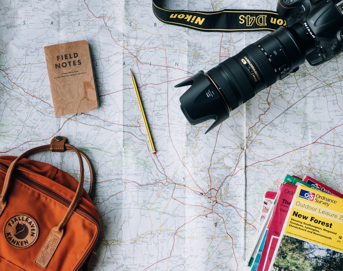 travel planning map camera notebook budget planning tips hidden costs